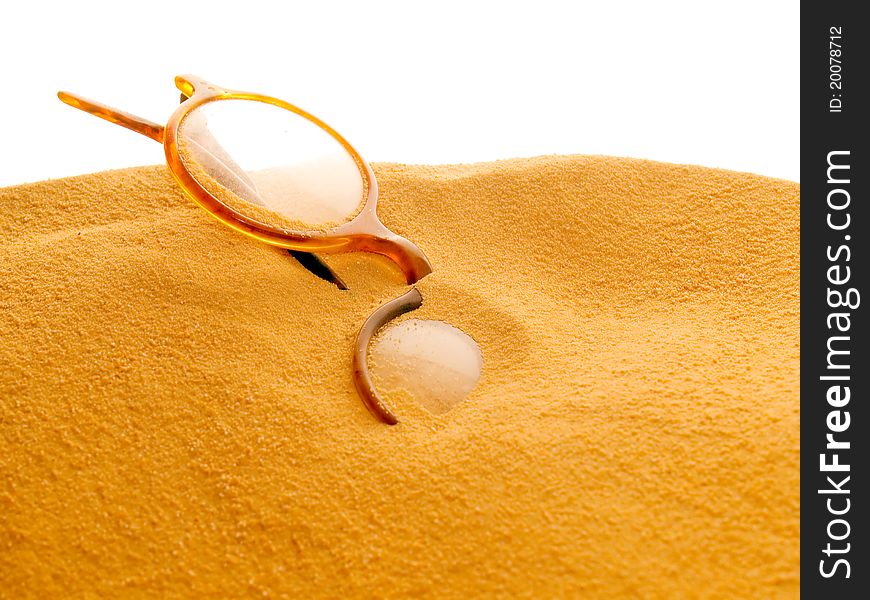 Glasses in sand isolated on white background. Glasses in sand isolated on white background.