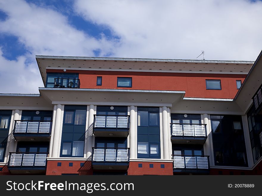 Modern red building with balconies. Modern red building with balconies