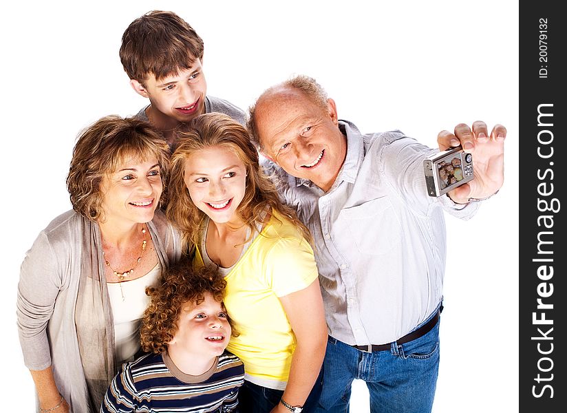 Happy family pilled together and taking self portrait. Happy family pilled together and taking self portrait.