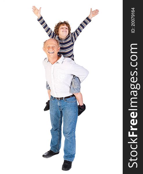 Grandfather giving grandson piggy-back against white background.