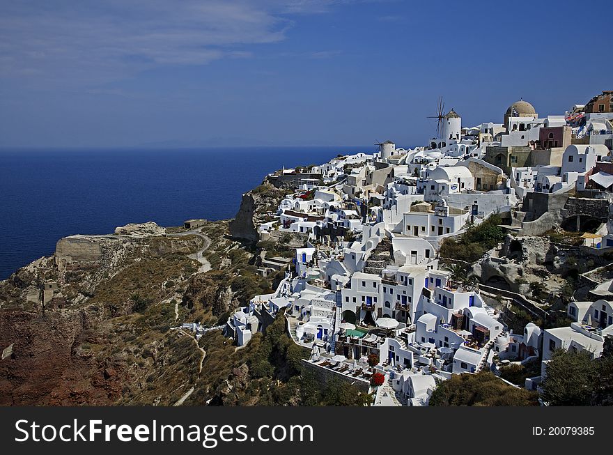 White washed buildings on top of Aegean sea in Oia the picturesque village of Santorini. White washed buildings on top of Aegean sea in Oia the picturesque village of Santorini