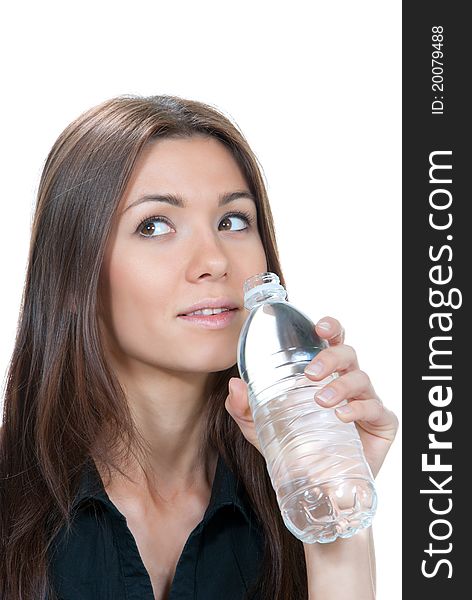 Woman drinking mineral water. Female holding in hand and drink sparkling still mineral bottled water isolated on a white background. Healthy lifestyle concept
