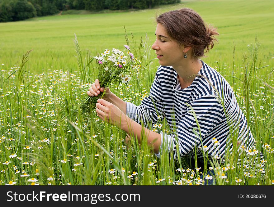 Young Woman In Field Of Blossom