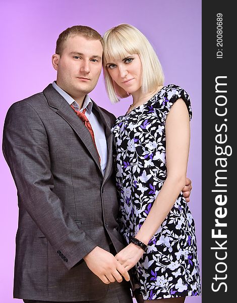 Beautiful young couple posing on a colored background. Beautiful young couple posing on a colored background