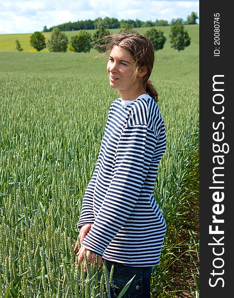 Young woman in the middle of wheat fields in Moravia, Czech Republic. Young woman in the middle of wheat fields in Moravia, Czech Republic