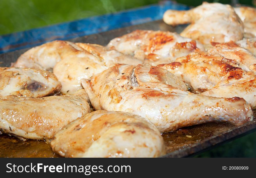 Chicken with honey and spices, cooking on a wood fire. Chicken with honey and spices, cooking on a wood fire