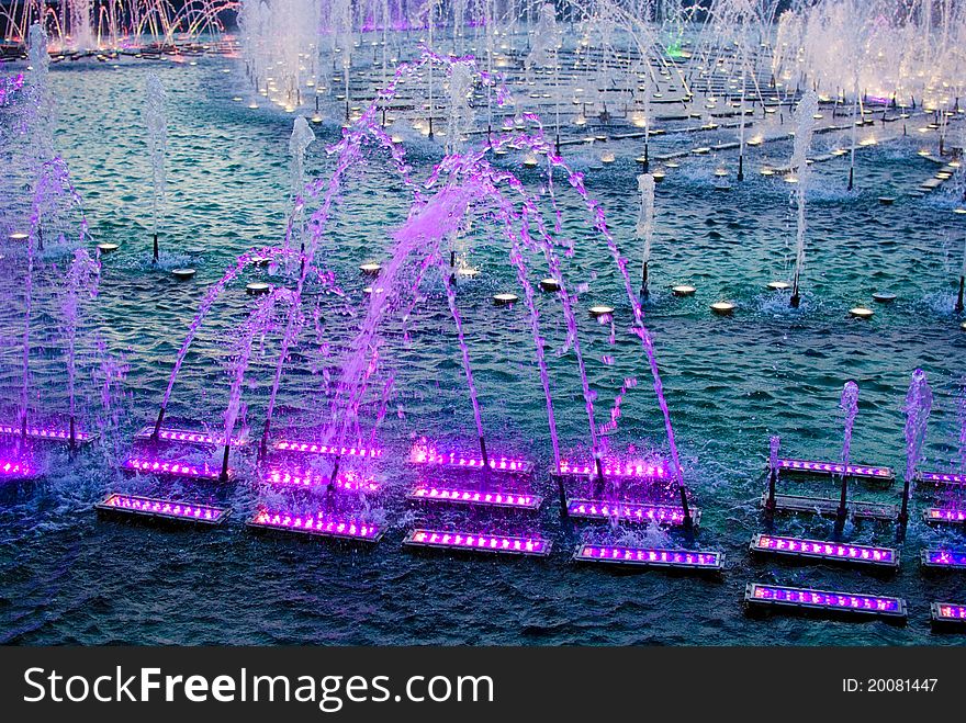 Picture of group of fountains with multi-colored illumination in Tsaritsyno-museum territory. Picture of group of fountains with multi-colored illumination in Tsaritsyno-museum territory.