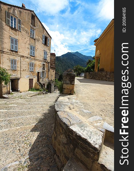 Village town square in Corsica with cobble stone street