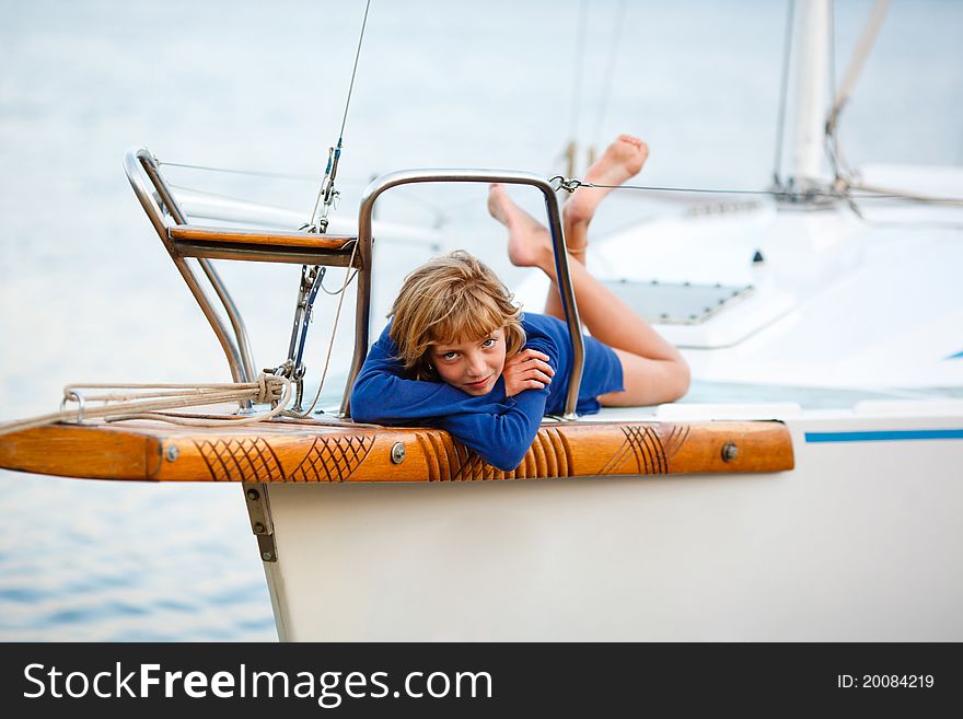 Playful pretty little girl on sail boat