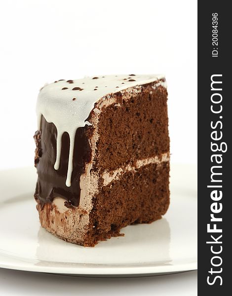 Single piece of chocolate cake on a white plate