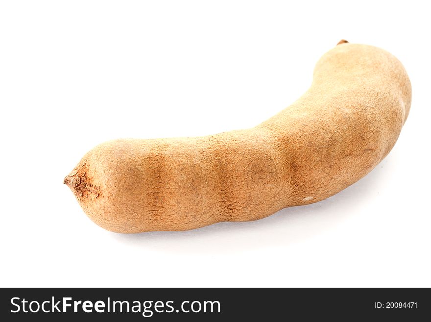 Fresh tamarind in the shell on a white background