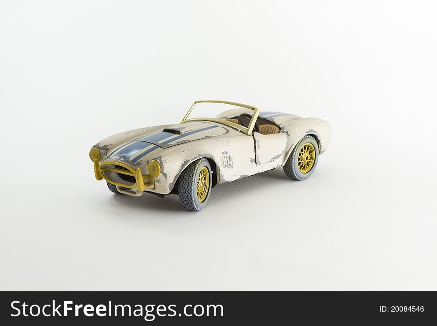 Studio photo of a vintage racing toy car. Studio photo of a vintage racing toy car