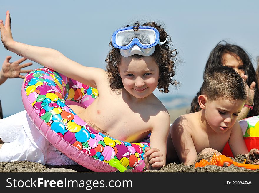 Child Group Have Fun And Play With Beach Toys