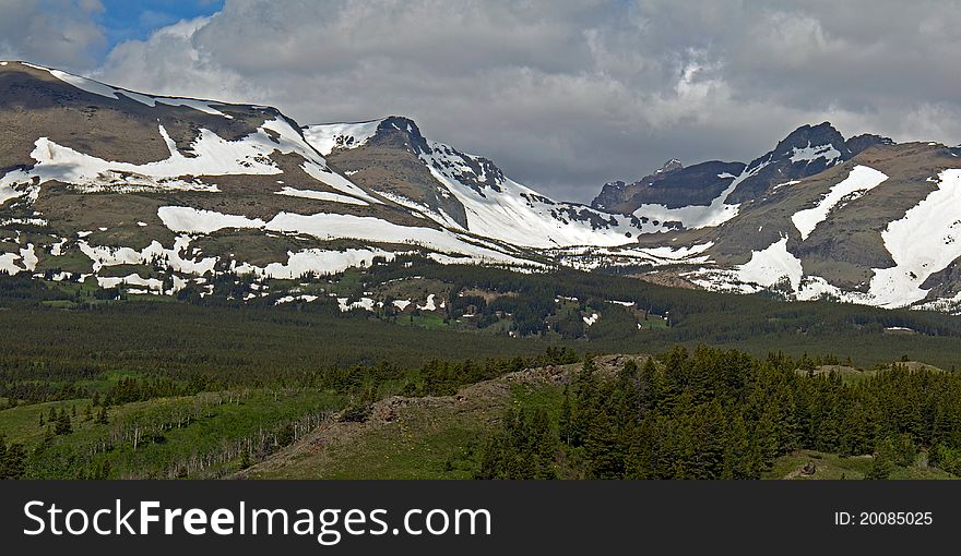 This image is actually two images stitched together and shows the spring conditions near Firebrand Pass in Glacier National Park, MT. This image is actually two images stitched together and shows the spring conditions near Firebrand Pass in Glacier National Park, MT.