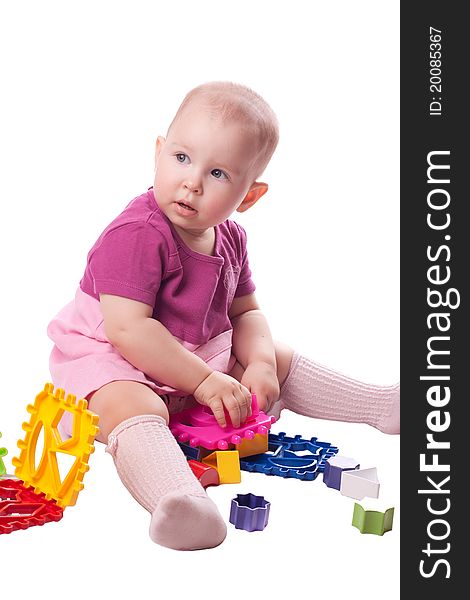 Sitting baby playing with toy isolated on white. Sitting baby playing with toy isolated on white