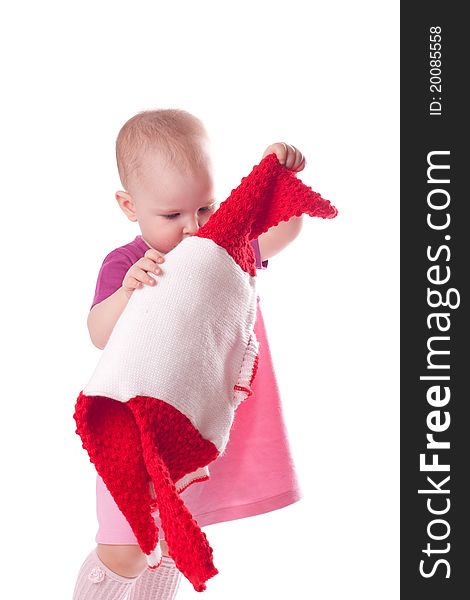 Little girl with wool dress in hands isolated on white