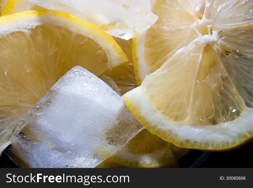 Close-up of slices of lemon with ice cube. Close-up of slices of lemon with ice cube