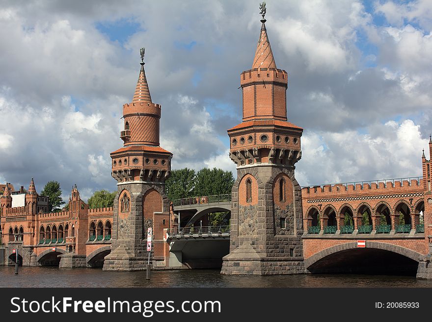 The towers of the upper tree bridge in front of dark clouds