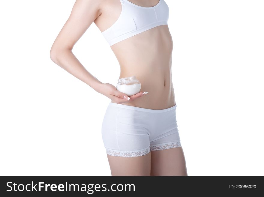 Beautiful female body isolated on white background. young woman in white panties. applying moisturizer cream on legs. Perfect female figure. Body beauty concept. Beautiful female body isolated on white background. young woman in white panties. applying moisturizer cream on legs. Perfect female figure. Body beauty concept.