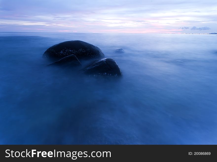 Sea and rock at the sunset. Nature composition. Sea and rock at the sunset. Nature composition.