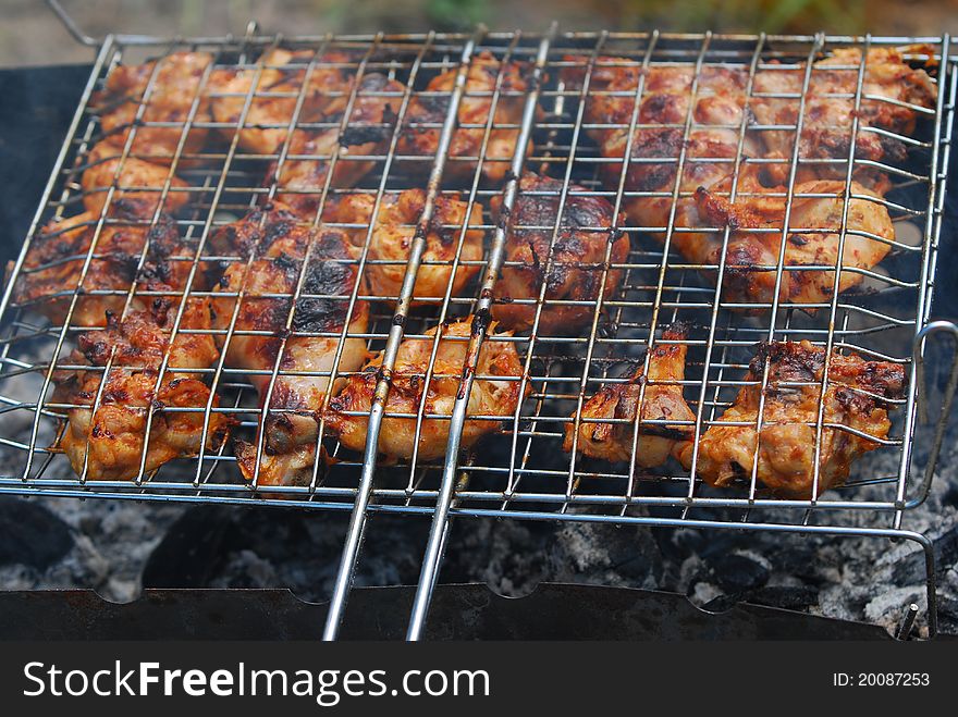 Preparing touristy food on the barbecue grate. Preparing touristy food on the barbecue grate