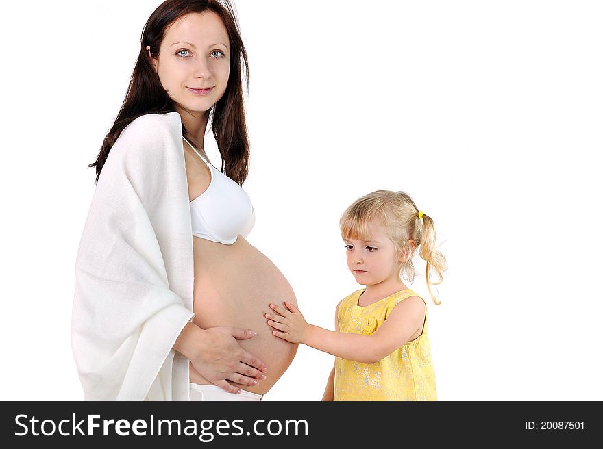 Little girl touches the belly of his pregnant mom. Little girl touches the belly of his pregnant mom