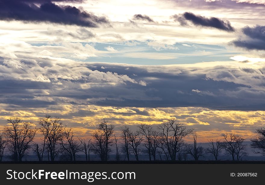 Ethereal sunset cloud and landscape in winter. Ethereal sunset cloud and landscape in winter