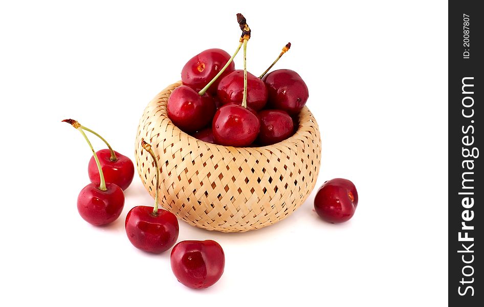 Cherries in a basket over white