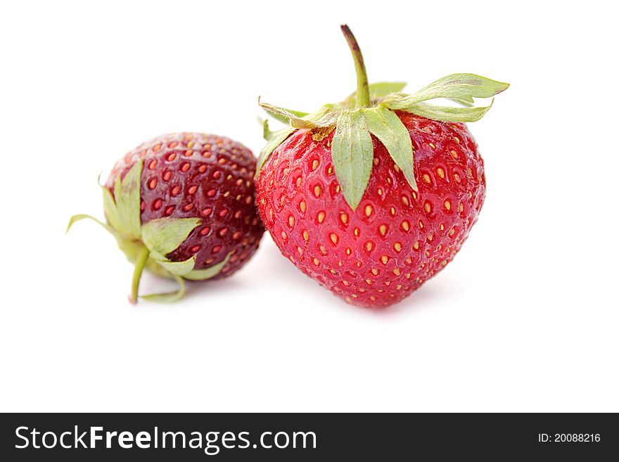 Ripe strawberry on a white background macro close-up of delicious berries isolated. Ripe strawberry on a white background macro close-up of delicious berries isolated