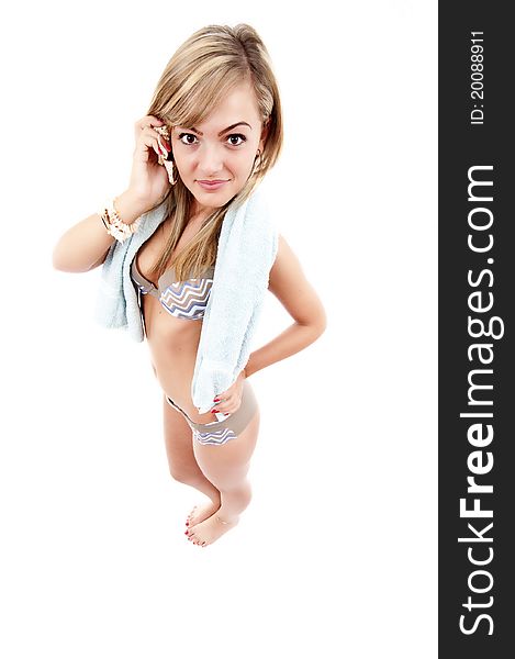 Beautiful blond girl wearing swimming costume, isolated over white background