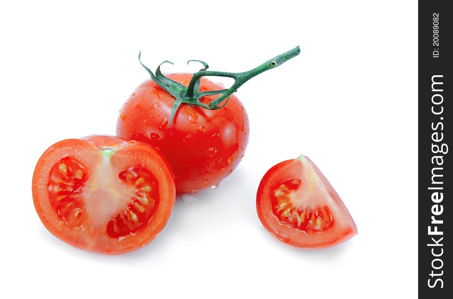 Tomato, half and quarter isolated on a white background