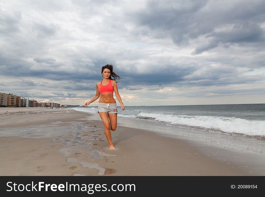 Young female running on the beach