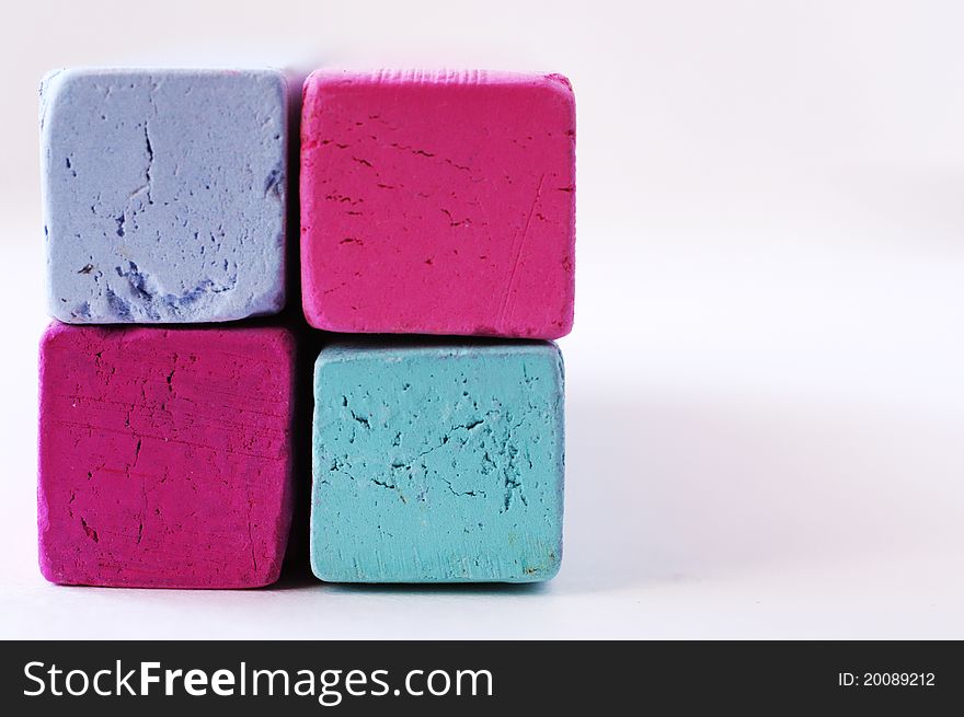 Pieces of blue and magenta Pastel Chalk used for Drawing pictures, Colorful, Checkered. Pieces of blue and magenta Pastel Chalk used for Drawing pictures, Colorful, Checkered