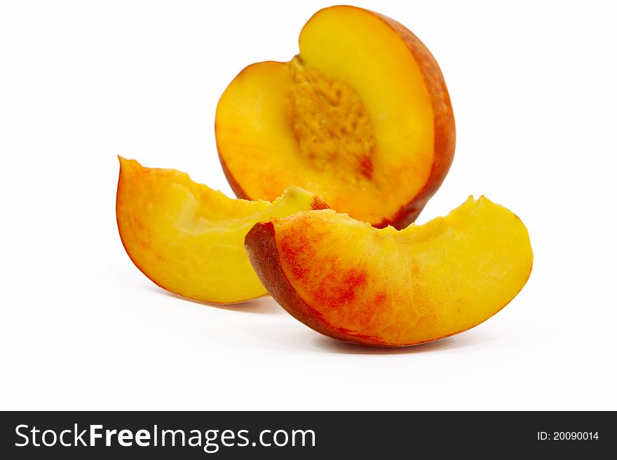 Peaches cut into wedges and whole peach