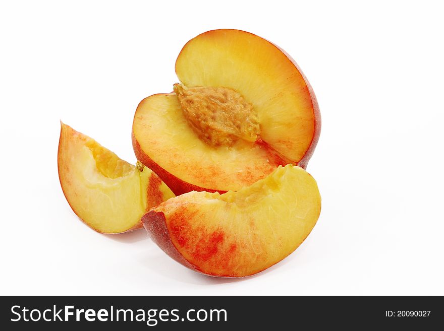 Peaches cut into wedges and whole peach