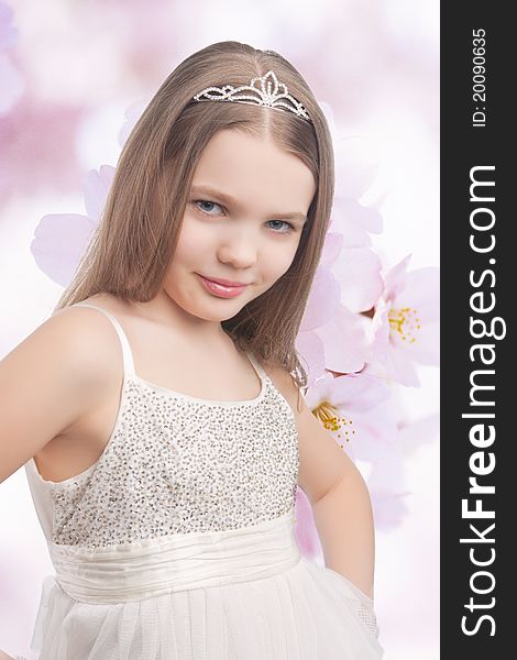Small little caucasian blond girl wearing crown standing over artistic background. Small little caucasian blond girl wearing crown standing over artistic background