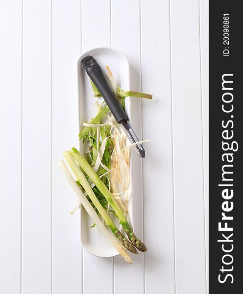 Food preparation - Peeling fresh asparagus spears. Food preparation - Peeling fresh asparagus spears