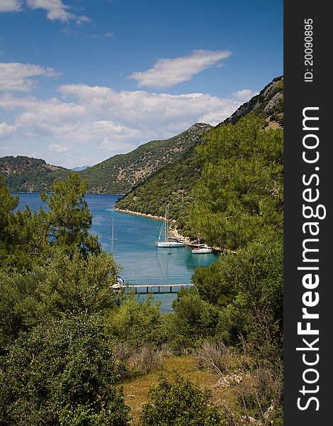 Sailing boat in remote beach cove. Sailing boat in remote beach cove