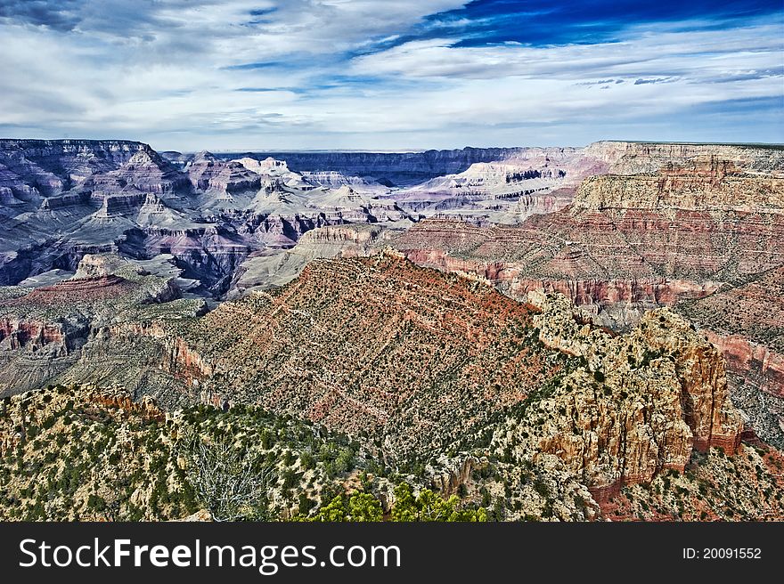 Grand Canyon from the top with blue sky and clouds