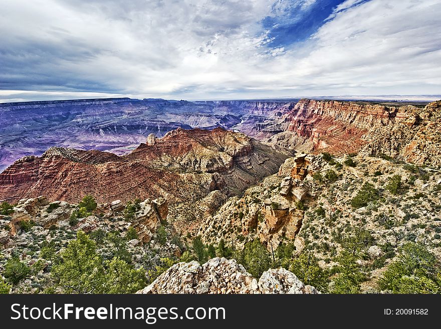 Grand Canyon from the top with blue sky and clouds