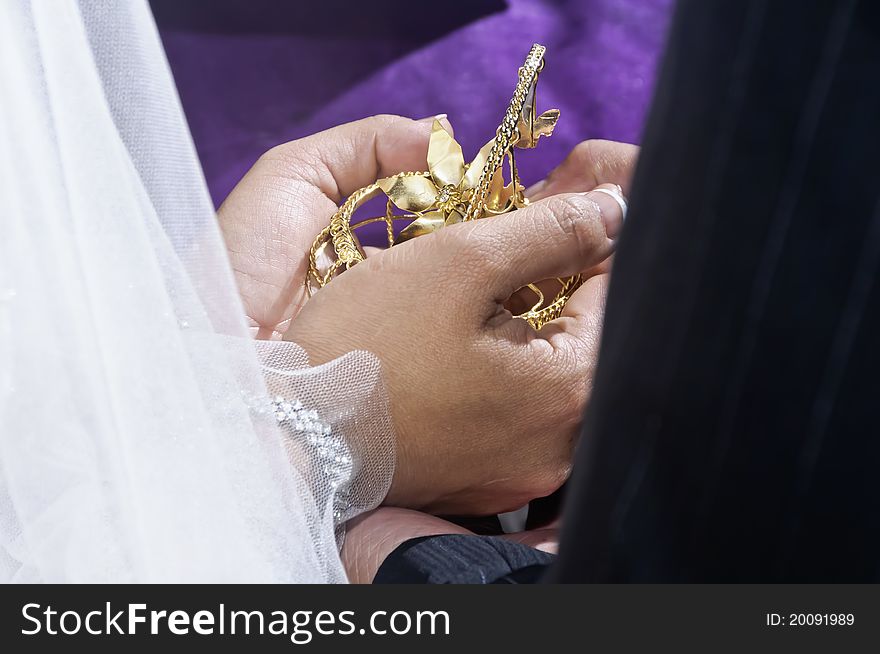 Arras and 13 coins symbolizing the groom's promise to his bride to suport her and their family