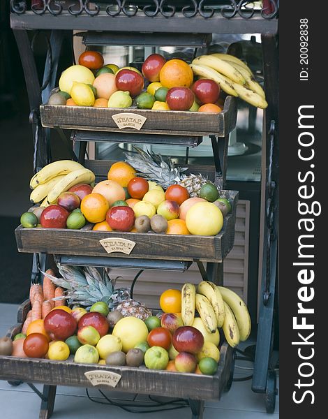 Shelf with fruits on street