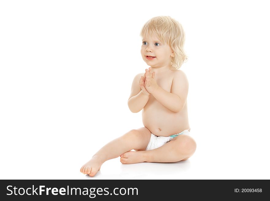 Sweet baby girl claps her hands isolated on white