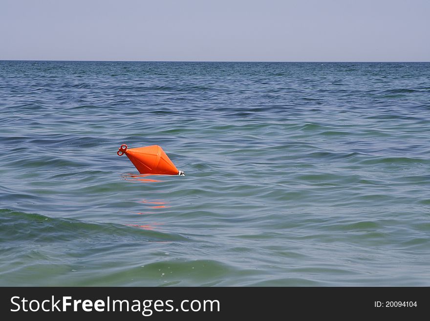 Orange buoy prevents swimmers for deep water