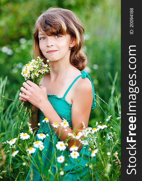 Little girl in the field with flowers. Little girl in the field with flowers