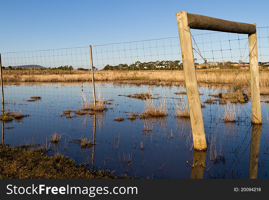 After heavy rains, this meadow in rural Tasmania is flooded.