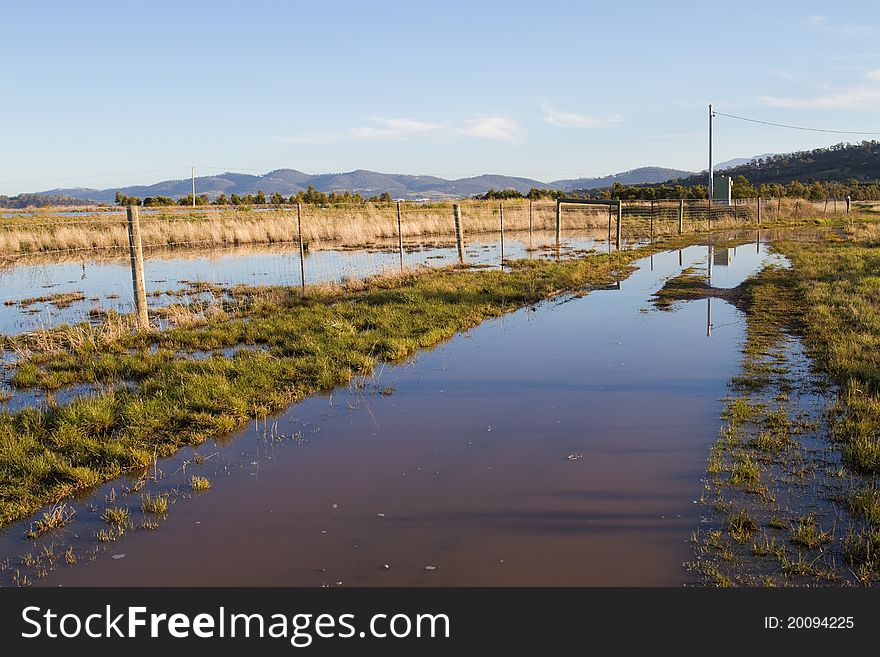 After heavy rains, this meadow in rural Tasmania is flooded.