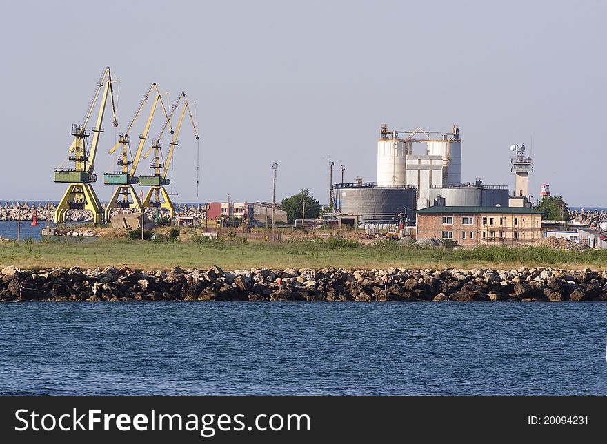 Harbour cranes and oil tanks at Black Sea coast