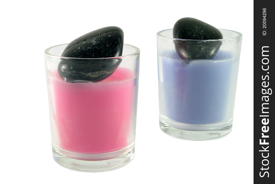 Two candles with black stones. Two candles with black stones