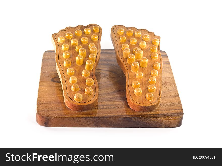 Wooden feet massage device isolated on white background